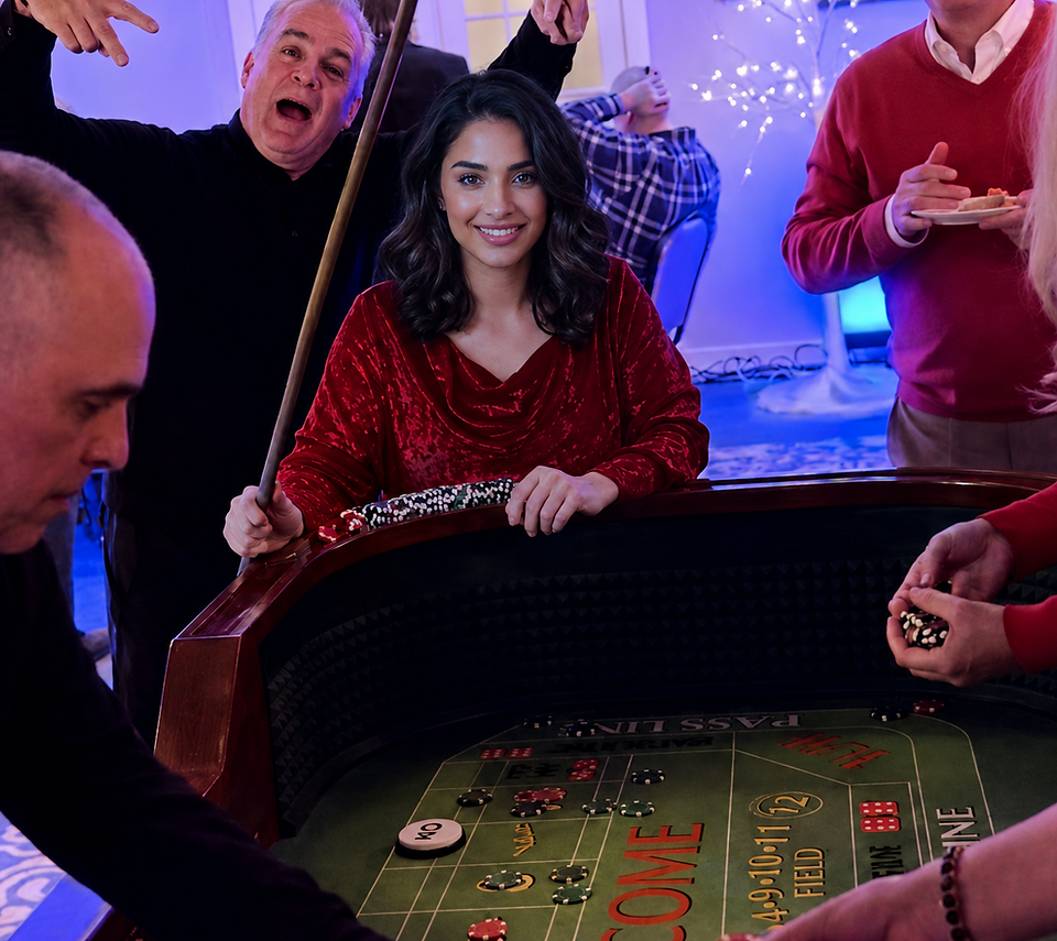Guests laughing at a craps table during a private party